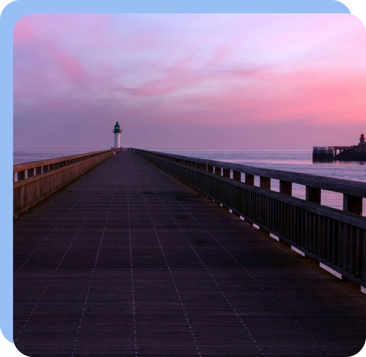 Pier extending into the sea at dusk